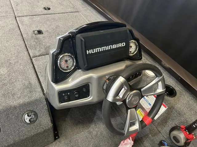 Slide: The Image of 2025 G3 Sportsman 1910 boat dashboard with Humminbird display and steering wheel. - 14