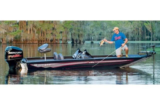 Slide: The Image of 2017 Ranger RT188 boat with Yamaha 115 SHO engine, man fishing on calm lake. - 14