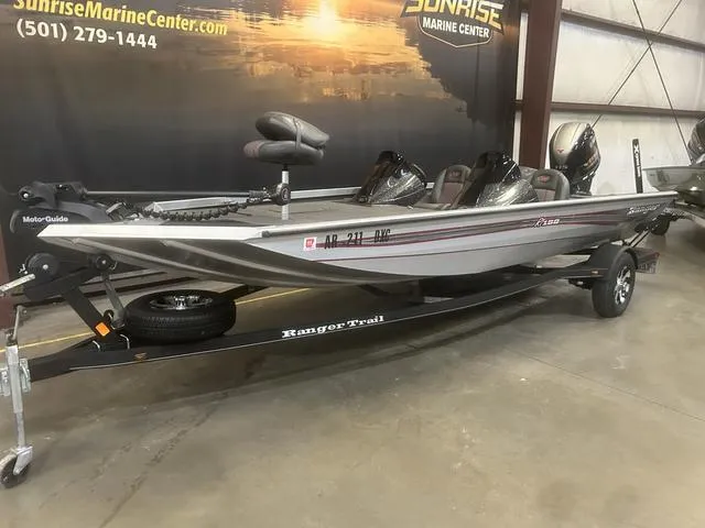 Slide: The Image of 2017 Ranger RT188 boat with Yamaha 115 SHO, displayed indoors on a trailer. - 2