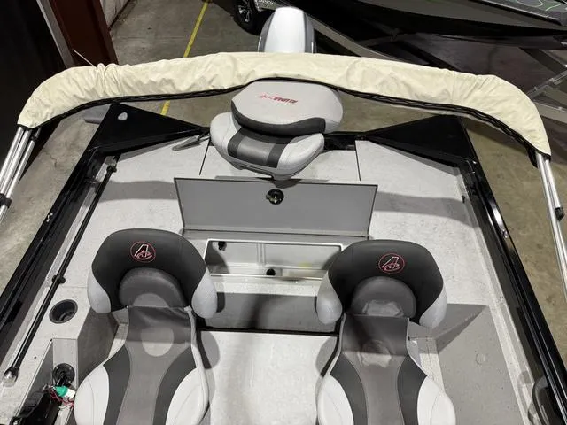Slide: The Image of 2020 Alumacraft 175 Prowler boat interior with three seats and a covered steering console. - 10
