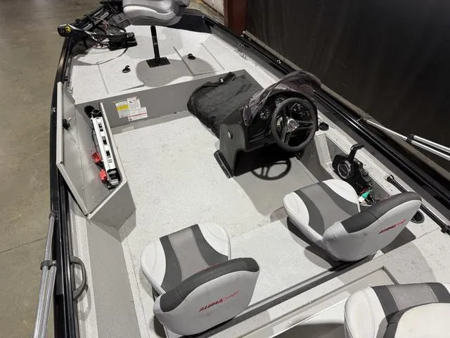 Slide: The Image of 2020 Alumacraft 175 Prowler boat interior with Honda 50 engine, featuring seating and steering console. - 11