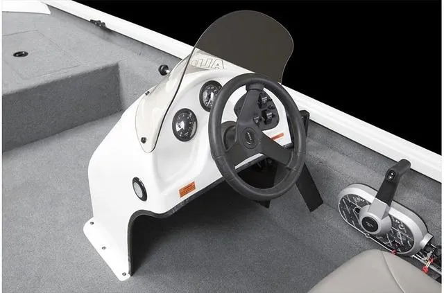Slide: The Image of 2020 Alumacraft 175 Prowler boat console with steering wheel and controls. - 19