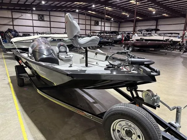 Slide: The Image of 2020 Alumacraft 175 Prowler with Honda 50 in a showroom, side view. - 3