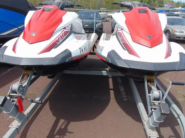 Slide: The Image of Two 2017 Yamaha WaveRunner VX jet skis on a trailer, parked outdoors. - 3