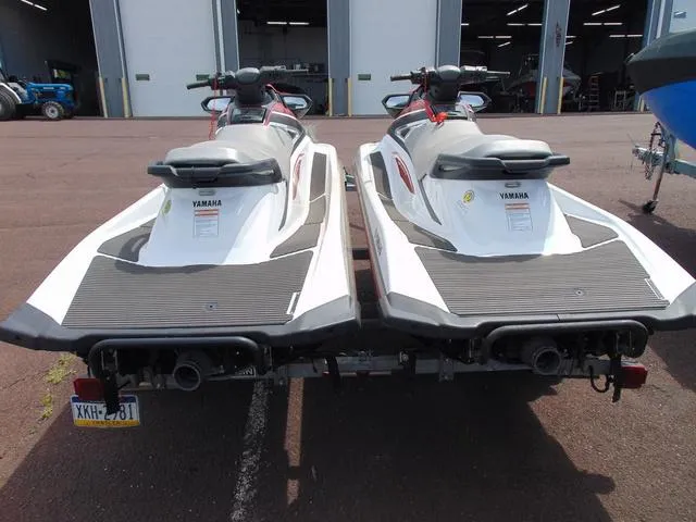 Slide: The Image of Two 2017 Yamaha WaveRunner VX jet skis on a trailer, parked outside a garage. - 6