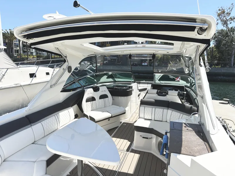 Slide: The Image of 2017 Sea Ray SLX 350 boat interior with luxurious seating and sleek design. - 16