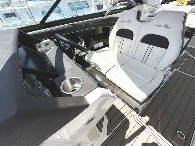 Slide: The Image of 2017 Sea Ray SLX 350 cockpit with luxurious seating and modern dashboard design. - 20