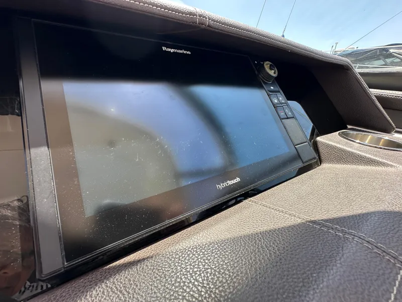 Slide: The Image of Dashboard of 2017 Sea Ray SLX 350 with Raymarine touchscreen display. - 23