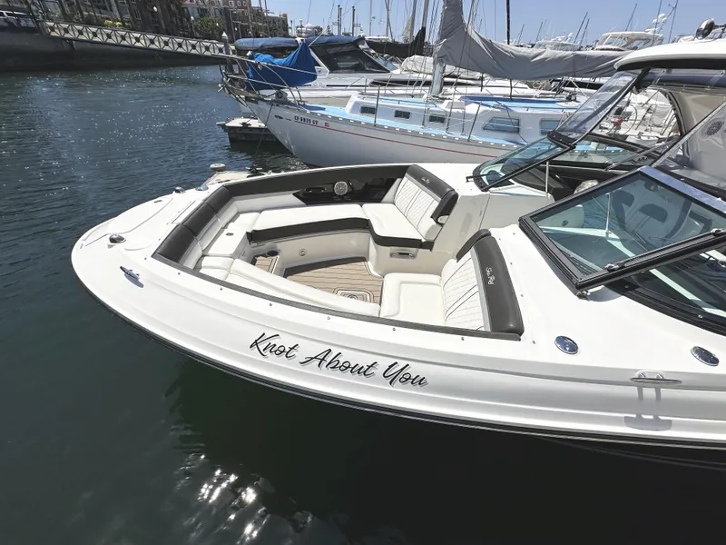 Slide: The Image of 2017 Sea Ray SLX 350 boat docked, featuring spacious seating and sleek design. - 27