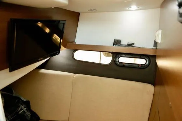 Slide: The Image of Interior cabin of 2017 Sea Ray SLX 350 with TV and seating area. - 30
