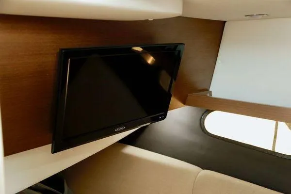 Slide: The Image of Interior of 2017 Sea Ray SLX 350 with mounted TV and window view. - 31