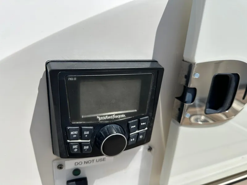 Slide: The Image of Control panel on 2017 Sea Ray SLX 350 boat, featuring Rockford Fosgate audio system. - 36