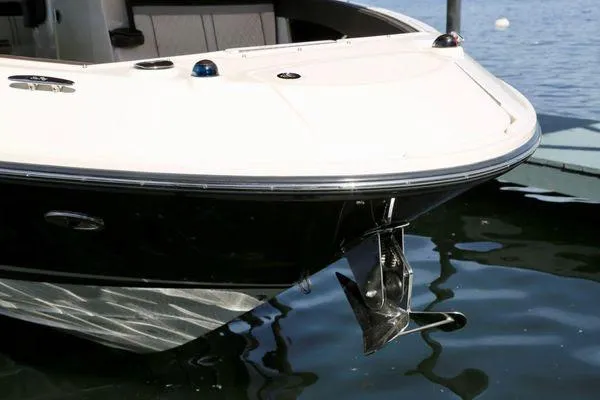 Slide: The Image of 2017 Sea Ray SLX 350 boat bow with anchor, docked on calm water. - 38