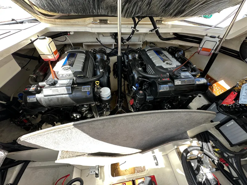 Slide: The Image of Engine compartment of a 2017 Sea Ray SLX 350 boat, featuring dual engines. - 39