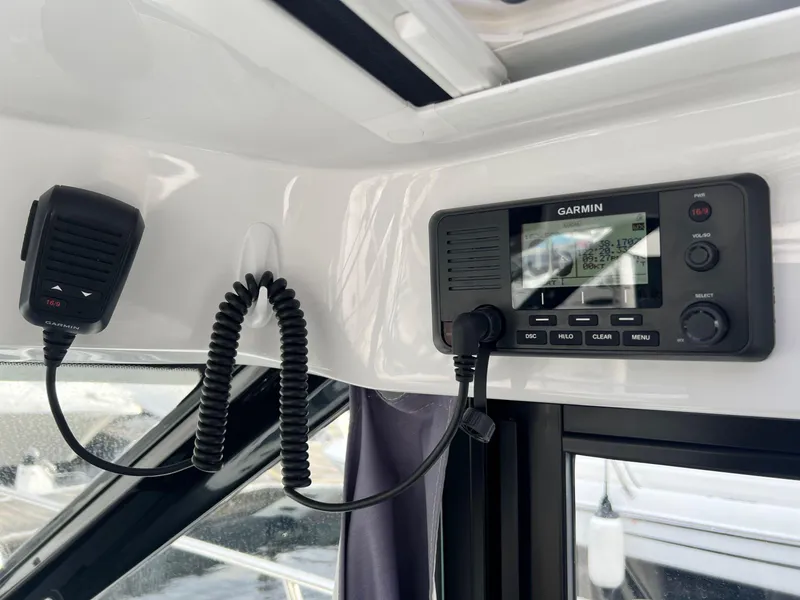 Slide: The Image of Garmin marine radio system inside 2023 Jeanneau NC 895 boat cockpit. - 3