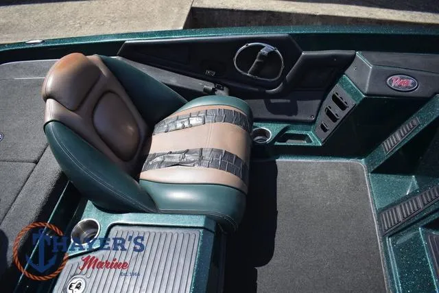 Slide: The Image of 2014 Ranger Z119c boat seat with duct tape repair, Thayer's Marine logo visible. - 11