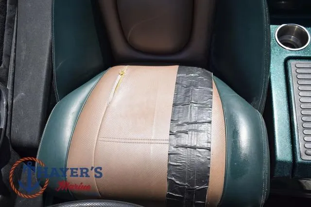 Slide: The Image of 2014 Ranger Z119c boat seat with duct tape repair and cup holder. - 15