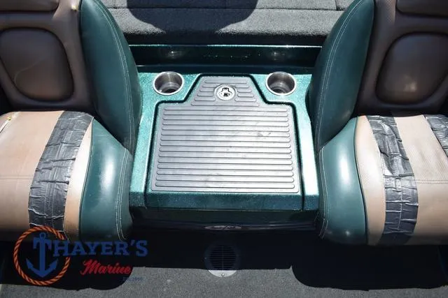 Slide: The Image of 2014 Ranger Z119c boat interior with cup holders and seating. - 17