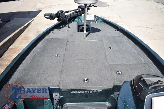 Slide: The Image of 2014 Ranger Z119c boat deck with trolling motor and seat, Thayer's Marine logo visible. - 20