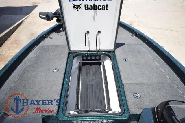 Slide: The Image of 2014 Ranger Z119c boat deck with open storage compartment, featuring Lowrance Bobcat branding. - 21