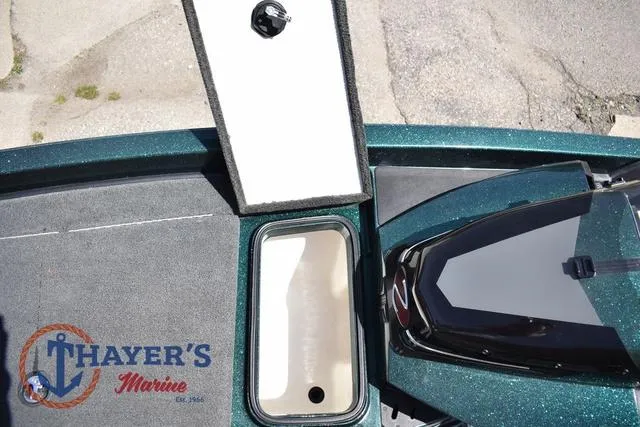 Slide: The Image of 2014 Ranger Z119c boat deck with storage compartment, Thayer's Marine logo visible. - 25