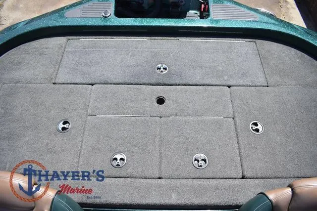 Slide: The Image of 2014 Ranger Z119c boat deck with storage compartments, featuring Thayer's Marine logo. - 32