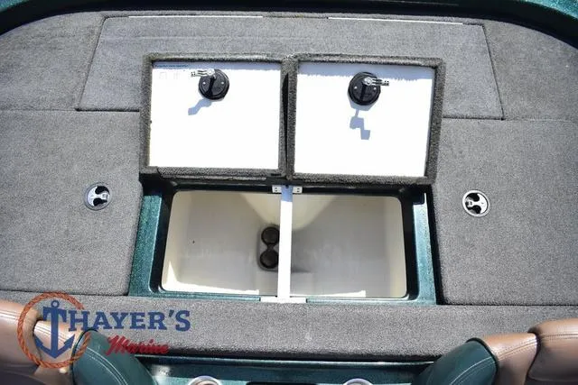 Slide: The Image of 2014 Ranger Z119c boat storage compartment with dual lids and Thayer's Marine logo. - 33