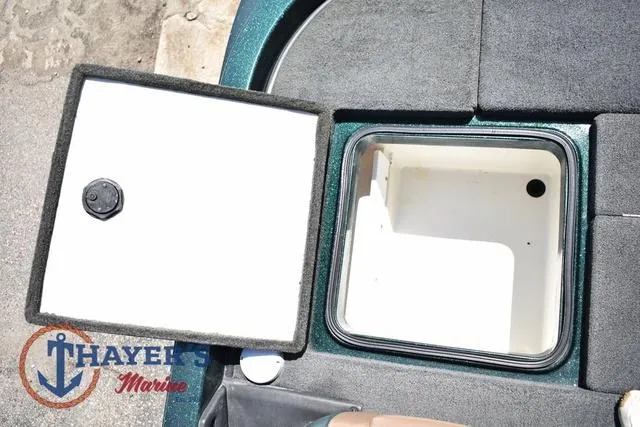 Slide: The Image of 2014 Ranger Z119c boat storage compartment with open lid, featuring Thayer's Marine logo. - 35