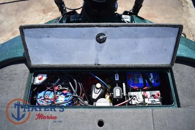 Slide: The Image of 2014 Ranger Z119c boat battery compartment with wiring and marine equipment. - 36