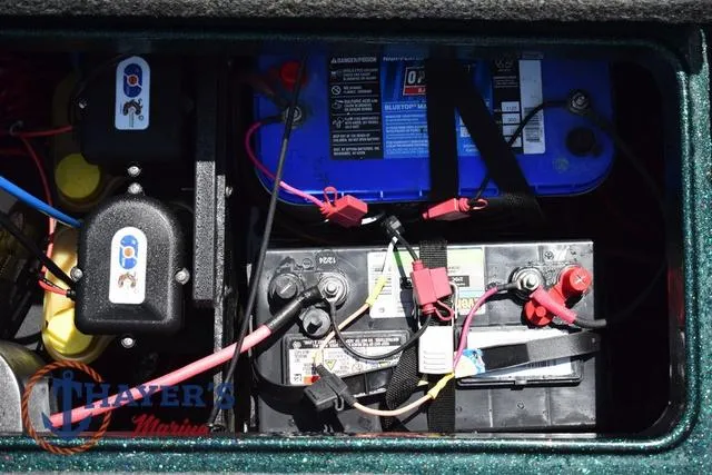 Slide: The Image of Battery compartment of a 2014 Ranger Z119c boat with wiring and connections. - 37