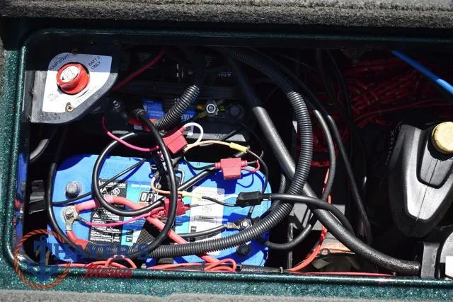 Slide: The Image of 2014 Ranger Z119c battery compartment with wiring and connections. - 38