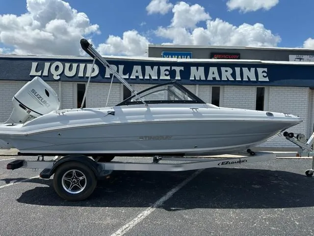 Slide: The Image of 2025 Stingray DC 191 boat on trailer at Liquid Planet Marine dealership. - 3