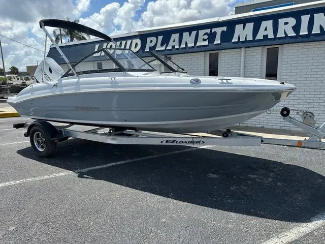 Slide: The Image of 2025 Stingray DC 191 boat on trailer at Liquid Planet Marine dealership. - 4