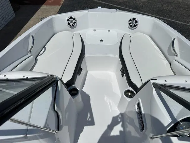 Slide: The Image of 2025 Stingray DC 191 boat interior with white seating and speakers. - 9