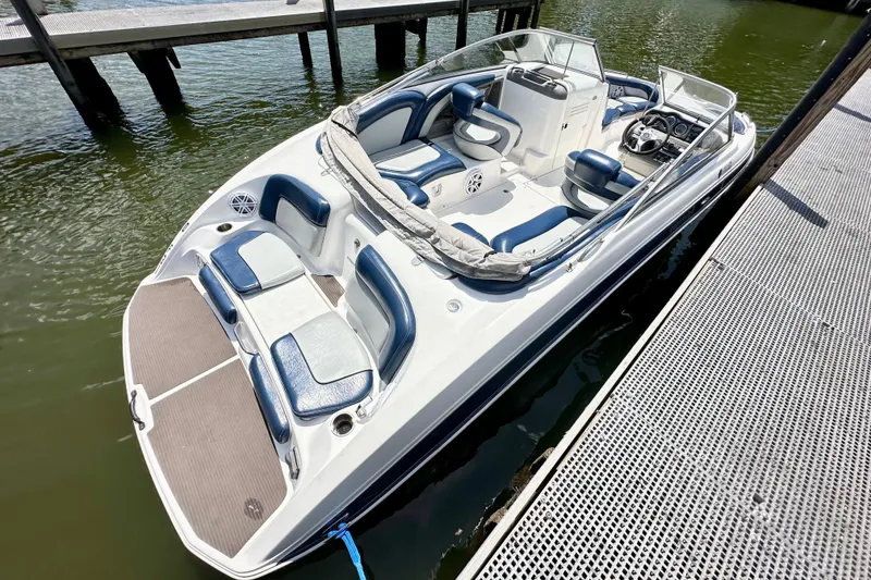 Slide: The Image of 2011 Yamaha Boats 242 Limited docked, featuring spacious seating and sleek design. - 22