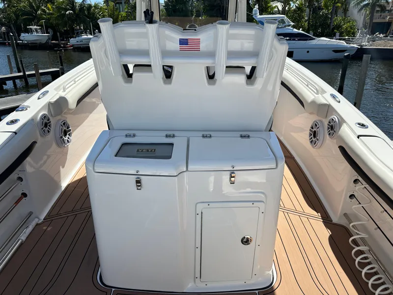 Slide: The Image of 2022 Tidewater 280 CC boat interior with fishing rod holders and storage compartments. - 12