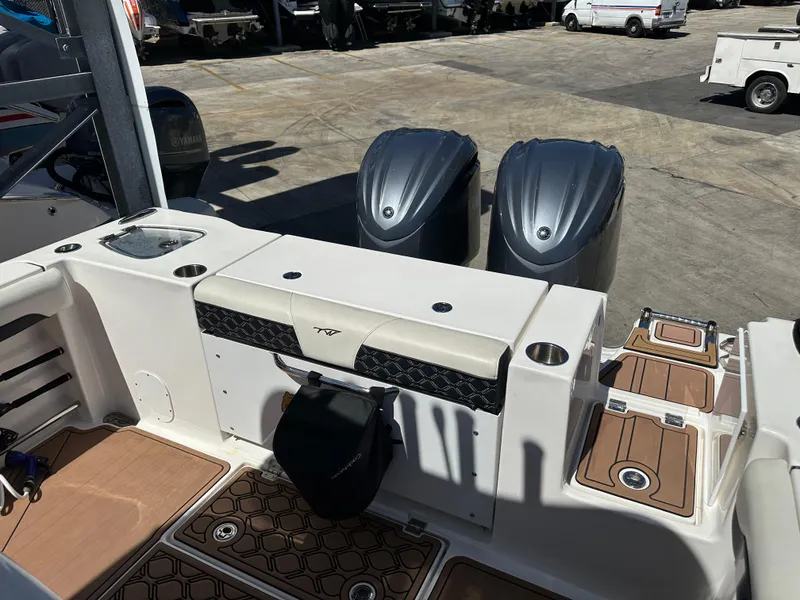 Slide: The Image of 2022 Tidewater 280 CC boat with dual engines and deck view. - 14