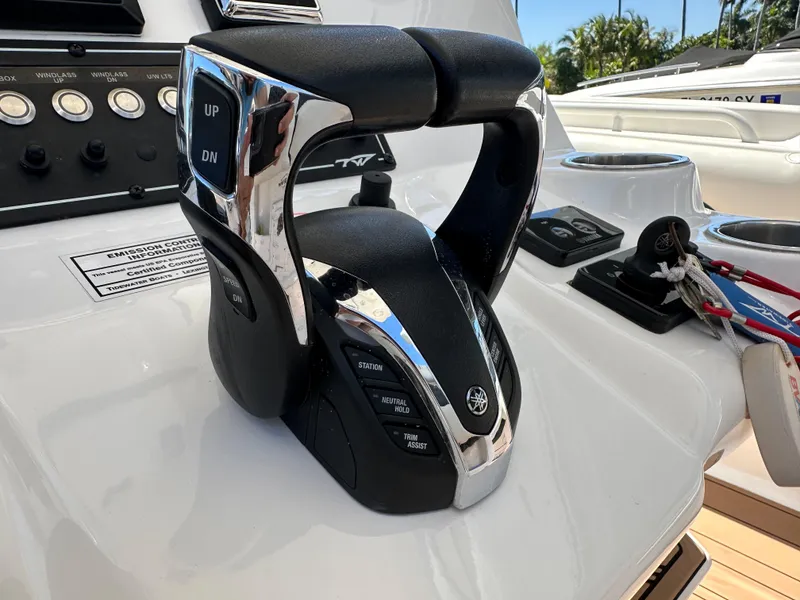 Slide: The Image of Throttle controls on a 2022 Tidewater 280 CC boat dashboard. - 21
