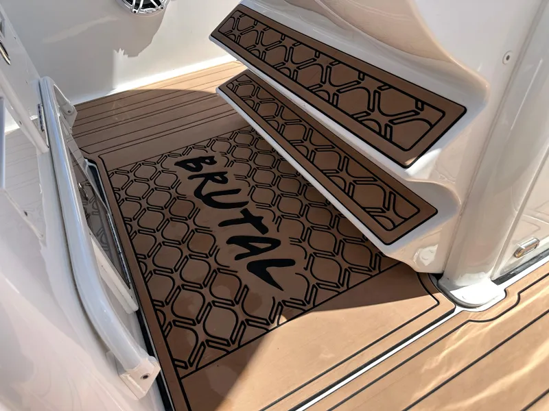 Slide: The Image of Tidewater 280 CC 2022 boat interior with custom "Brutal" mat design. - 23