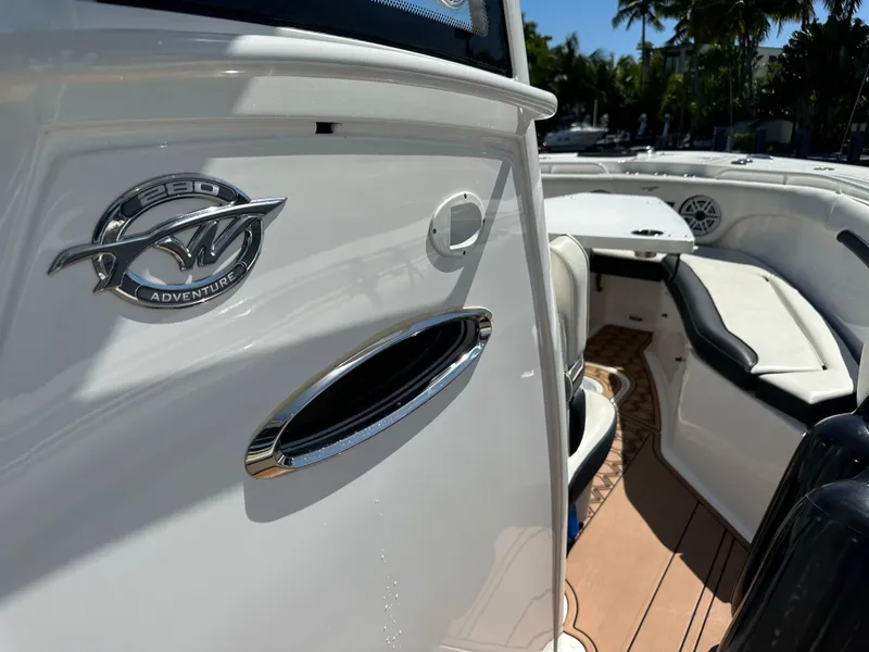 Slide: The Image of 2022 Tidewater 280 CC boat interior with seating and logo detail. - 31