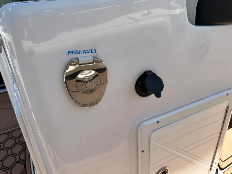 Slide: The Image of Tidewater 280 CC 2022 boat with fresh water access panel. - 32