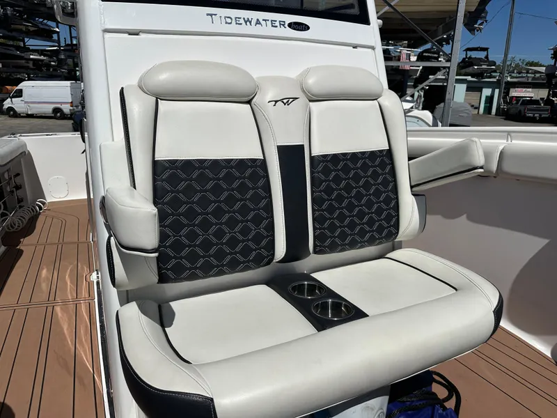 Slide: The Image of 2022 Tidewater 280 CC boat with stylish dual seats and cup holders. - 33