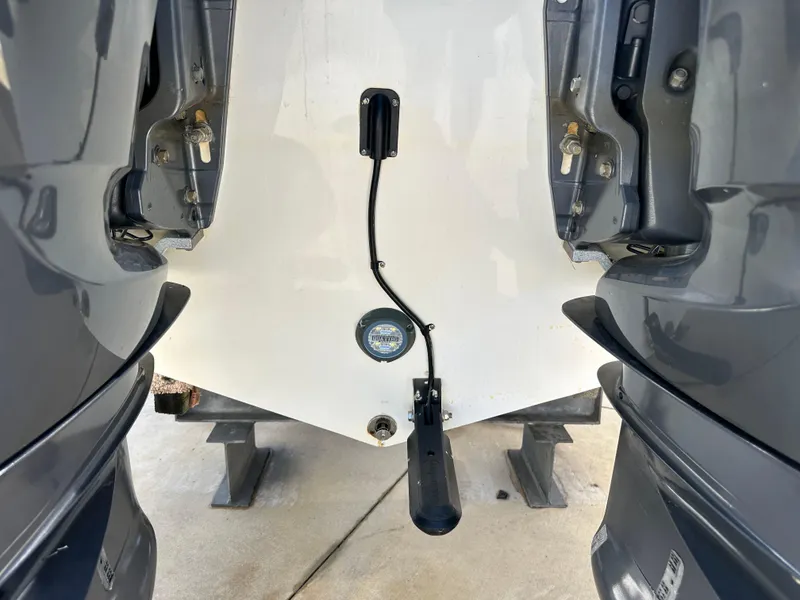 Slide: The Image of Rear view of 2022 Tidewater 280 CC boat with dual outboard motors. - 4