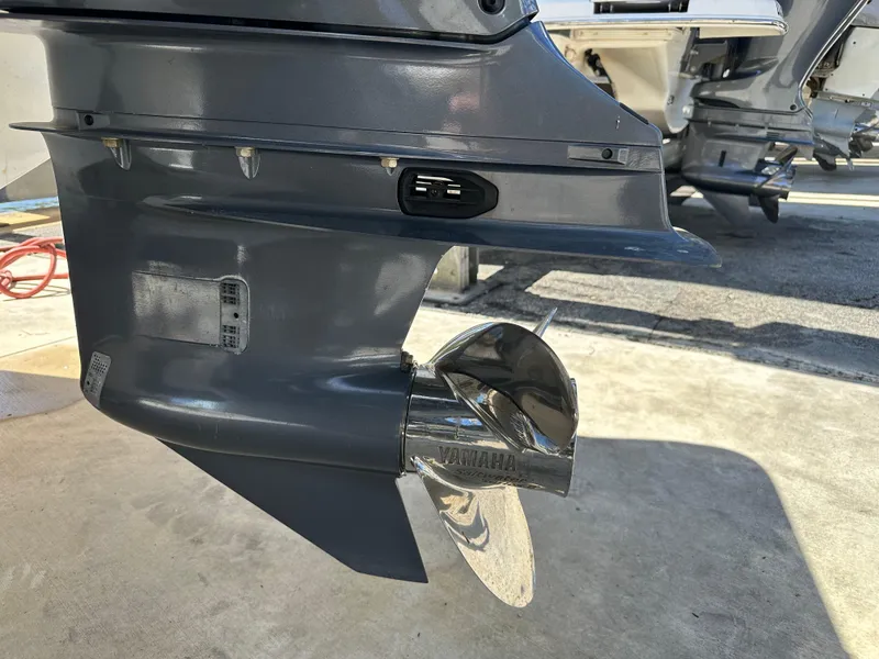 Slide: The Image of Outboard motor of a 2022 Tidewater 280 CC boat with a shiny propeller. - 6