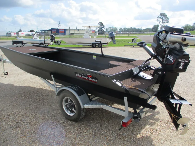 Slide: The Image of 2025 Gator Tail 1748 GATOR boat on trailer, parked outdoors. - 3
