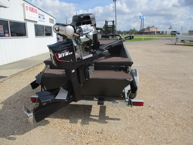 Slide: The Image of 2025 Gator Tail 1748 GATOR boat with powerful engine, parked outside dealership. - 4