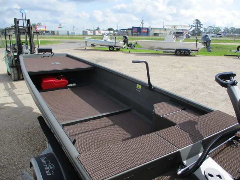 Slide: The Image of 2025 Gator Tail 1748 GATOR boat on trailer, parked outdoors, with visible red fuel tank. - 5