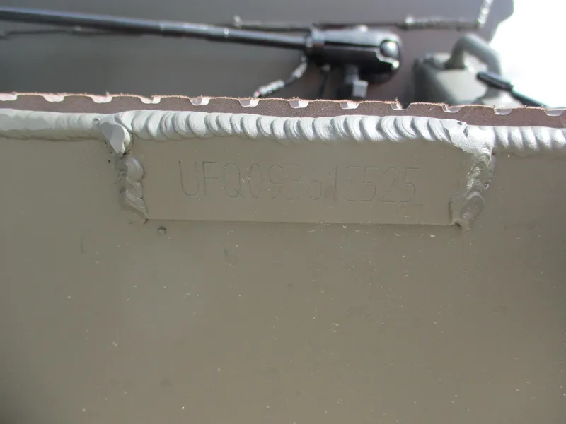 Slide: The Image of 2025 Gator Tail 1748 GATOR boat hull with visible serial number and welding details. - 8