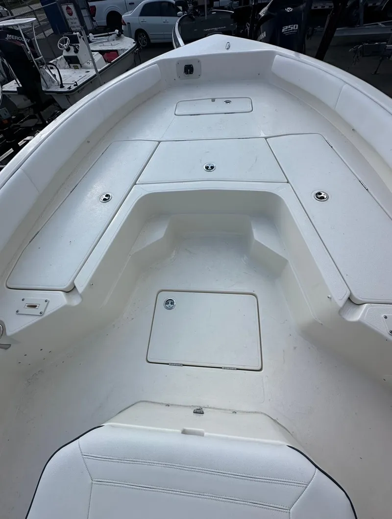Slide: The Image of 2025 Skeeter SX 2350 boat deck with storage compartments and seating area. - 4