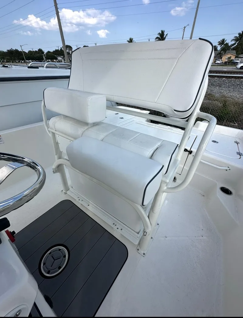 Slide: The Image of 2025 Skeeter SX 2350 boat seat with white cushioned design and sturdy frame. - 5